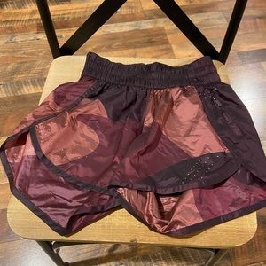 In good condition. Silky material(100% Nylon). No liner inside. size 4